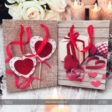 A stylish gift bag for her, featuring a sleek design and elegant accents. The bag is displayed with sturdy handles, showcasing its spacious interior ideal for various gifts, perfect for special occasions.